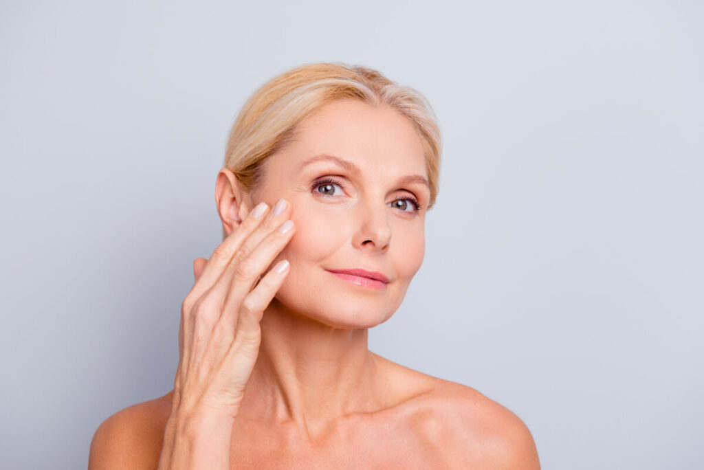 woman posing after microneedling treatment