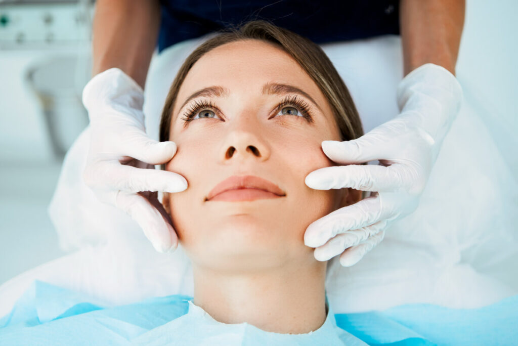 professional cosmetic doctor preparing a client for a rf microneedling treatment