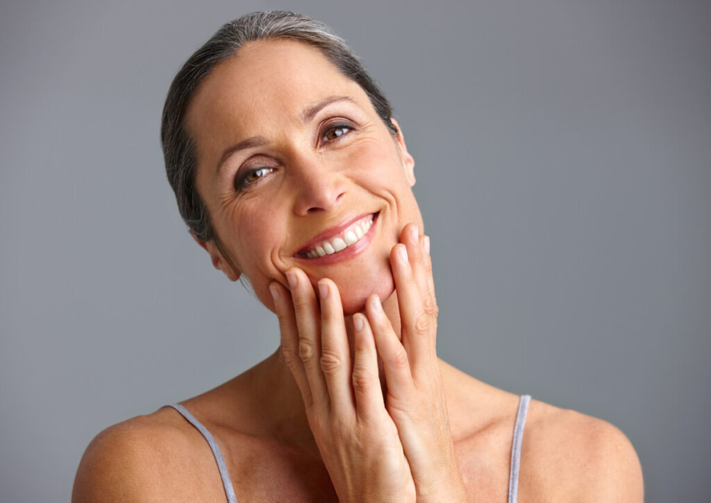 elderly woman has rejuvenated her skin with rf microneedling treatments